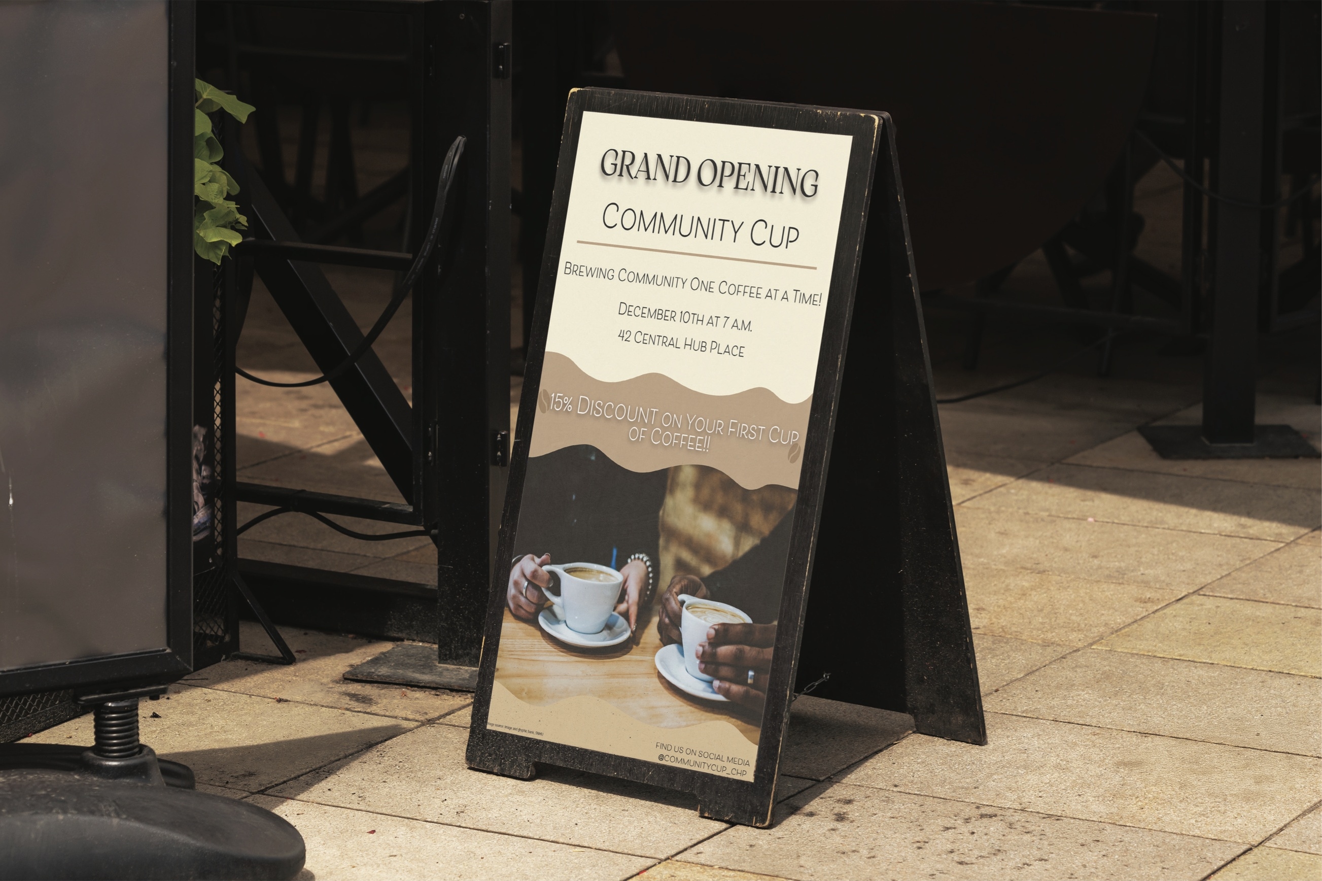 Community Cup grand opening poster displayed on a sidewalk sign